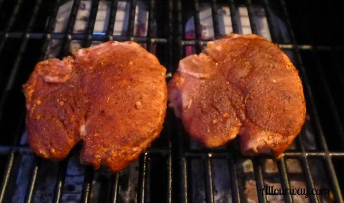 Perfect gas grilled pork chops with meat rub .