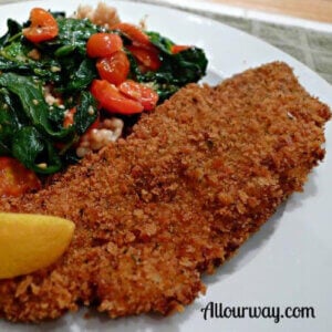 Crispy fried black drum fillet on plate.