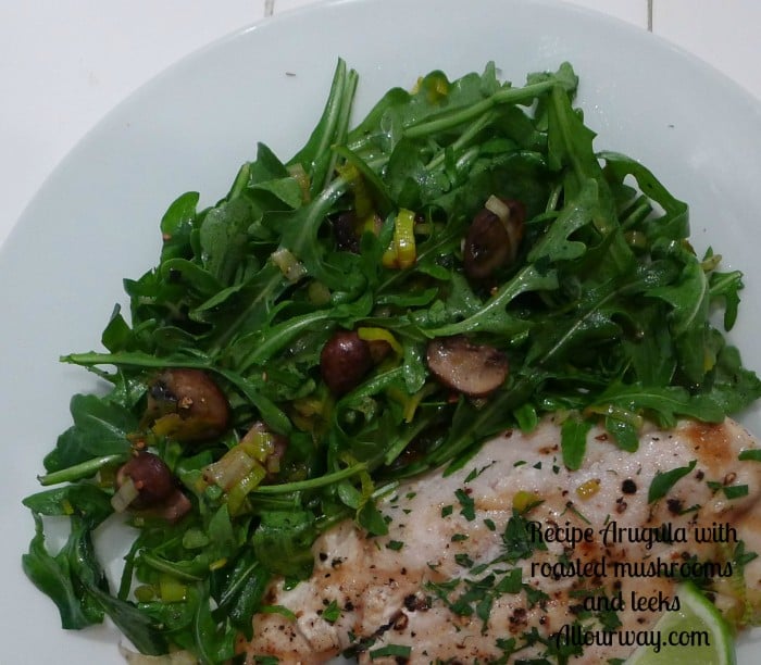 Baby arugula tossed with roasted mushrooms and leeks