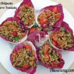 An antipasto made with Farro salad and stuffed into lettuce leaves.