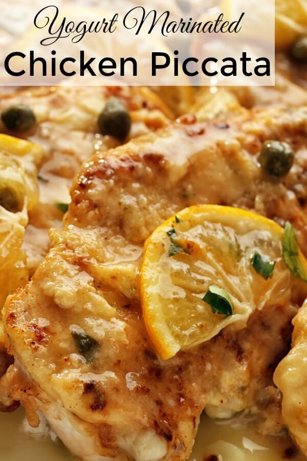 Slice of lemon and green caper buds cover the golden brown chicken piccata breasts. 