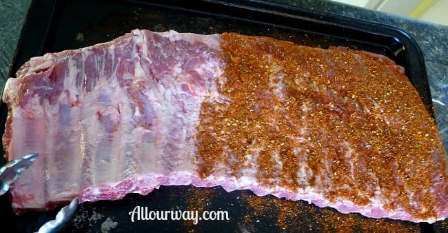 Smoked Pork Ribs Adding All Our Way Rub at Allourway.com