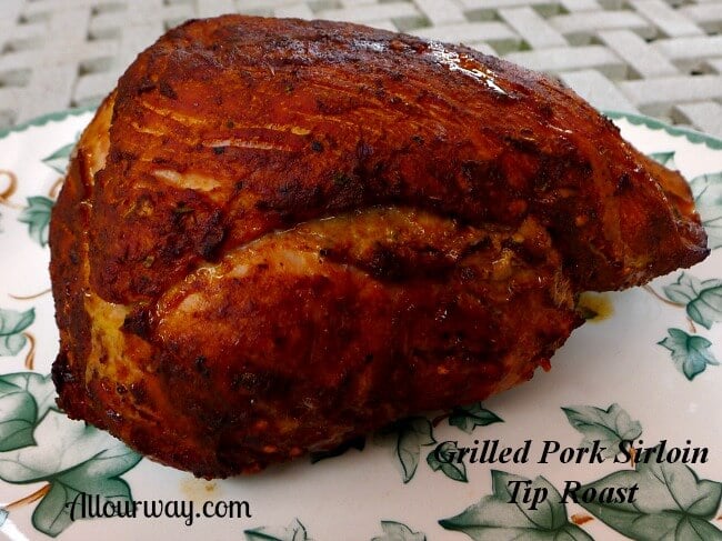 Grilled Pork Sirloin Tip Roast from Costco Resting on a green leaf platter.