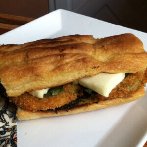 Caprese Flatbread Sandwich with Fried Green Tomatoes and Mozzarella Cheese.