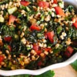 A closeup of Tabbouleh made with Kale and Farro with tomatoes.