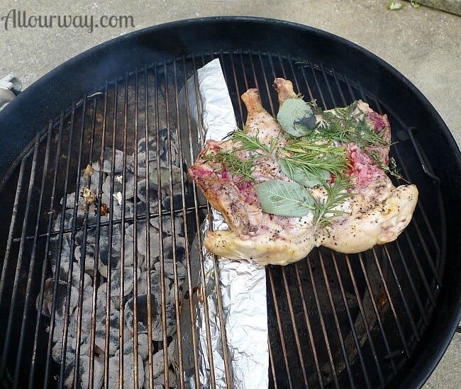 Chicken is moved to the unlit portion of the grill for the pollo al mattone @allourway.com