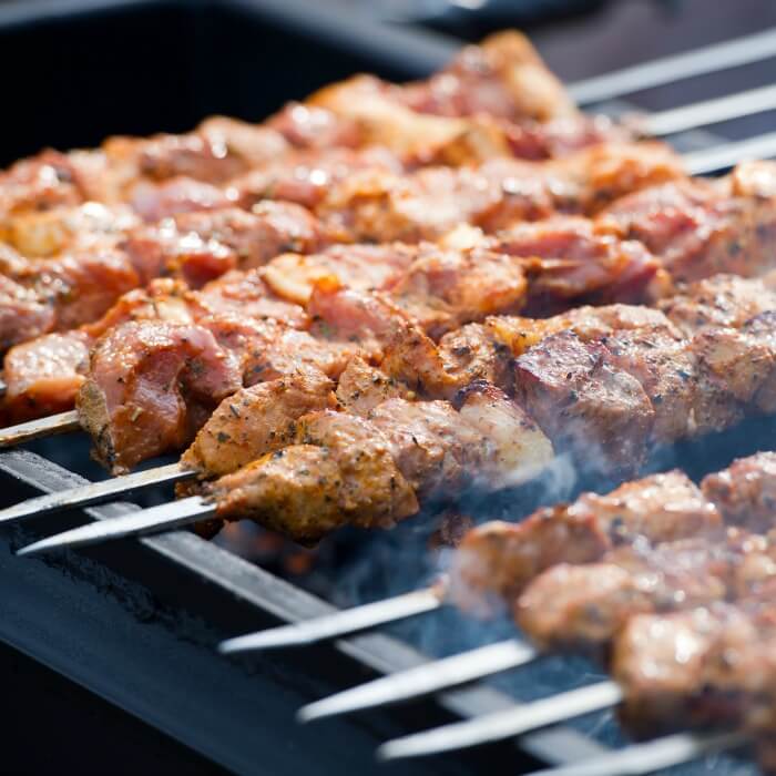 Grilled Pork Kebabs on Skewers over a hot grill. 