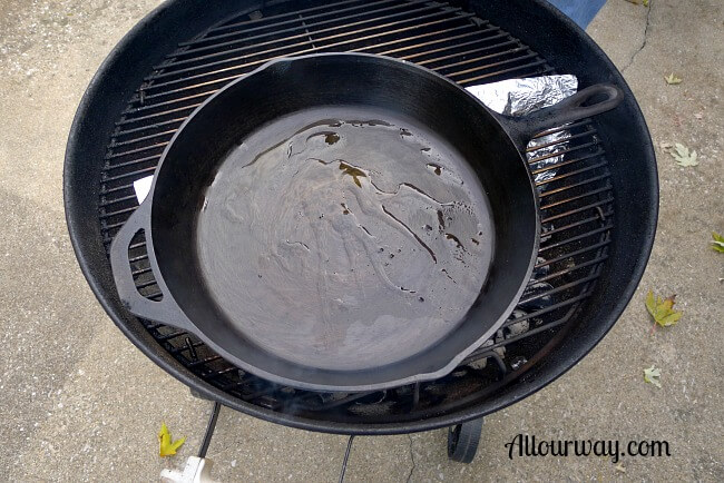 Cast-iron skillet is heating on direct heat side of grill for Pollo al Mattone @ allourway.com