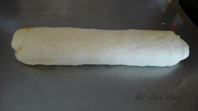 Cheese-filled crusty panini dough rolled and seam side down @allourway.com
