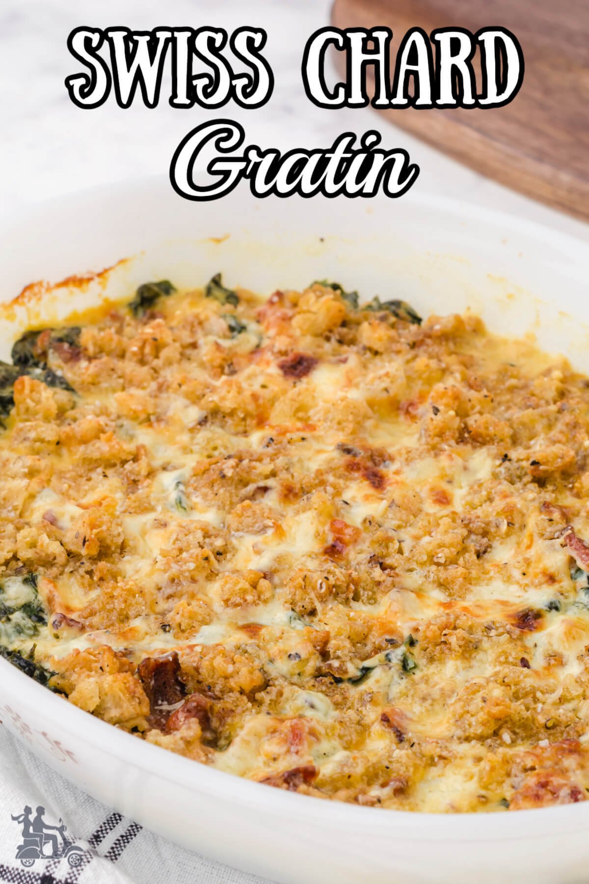 Swiss Chard Gratin in a white casserole made with bacon and homemade bread crumbs. 