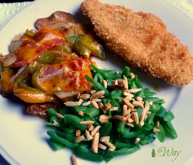 Grilled cheesy potatoes, peppers, bacon, onions with crunchy fired fish and green beans almondine @allourway.com