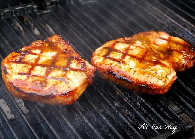 Maple Chipotle Glaze is slathered on grilling pork chops @allourway.com