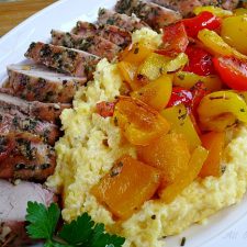 Grilled pork tenderloin with colored peppers over polenta @ allourway.com