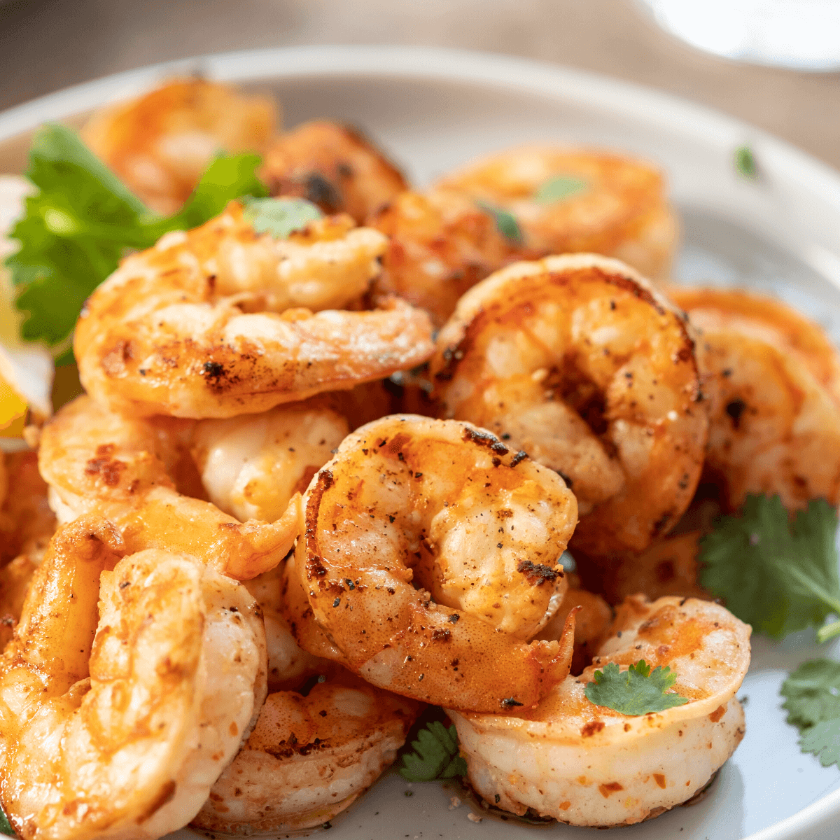 Grilled Shrimp with Parsley and lemon in White casserole dish 