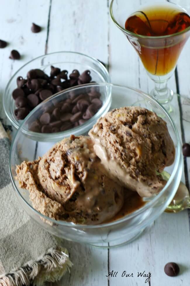 No churn Nutella Hazelnut Chocolate Chip Ice Cream with a glass of Frangelico liqueur and a bowl of chocolate chips @allourway.com