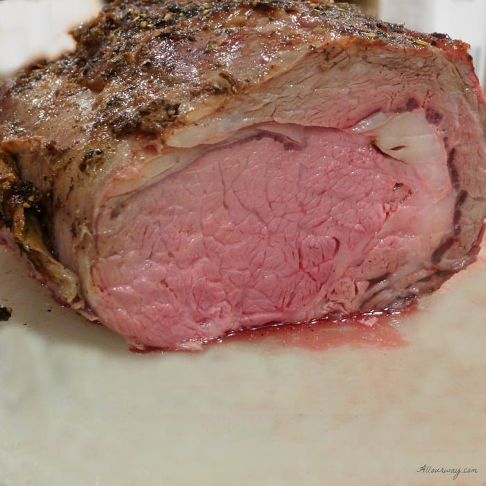 Dry Aged Standing Rib Roast seasoned with an herb rub and roasted on a bed of savory vegetables @allourway.com