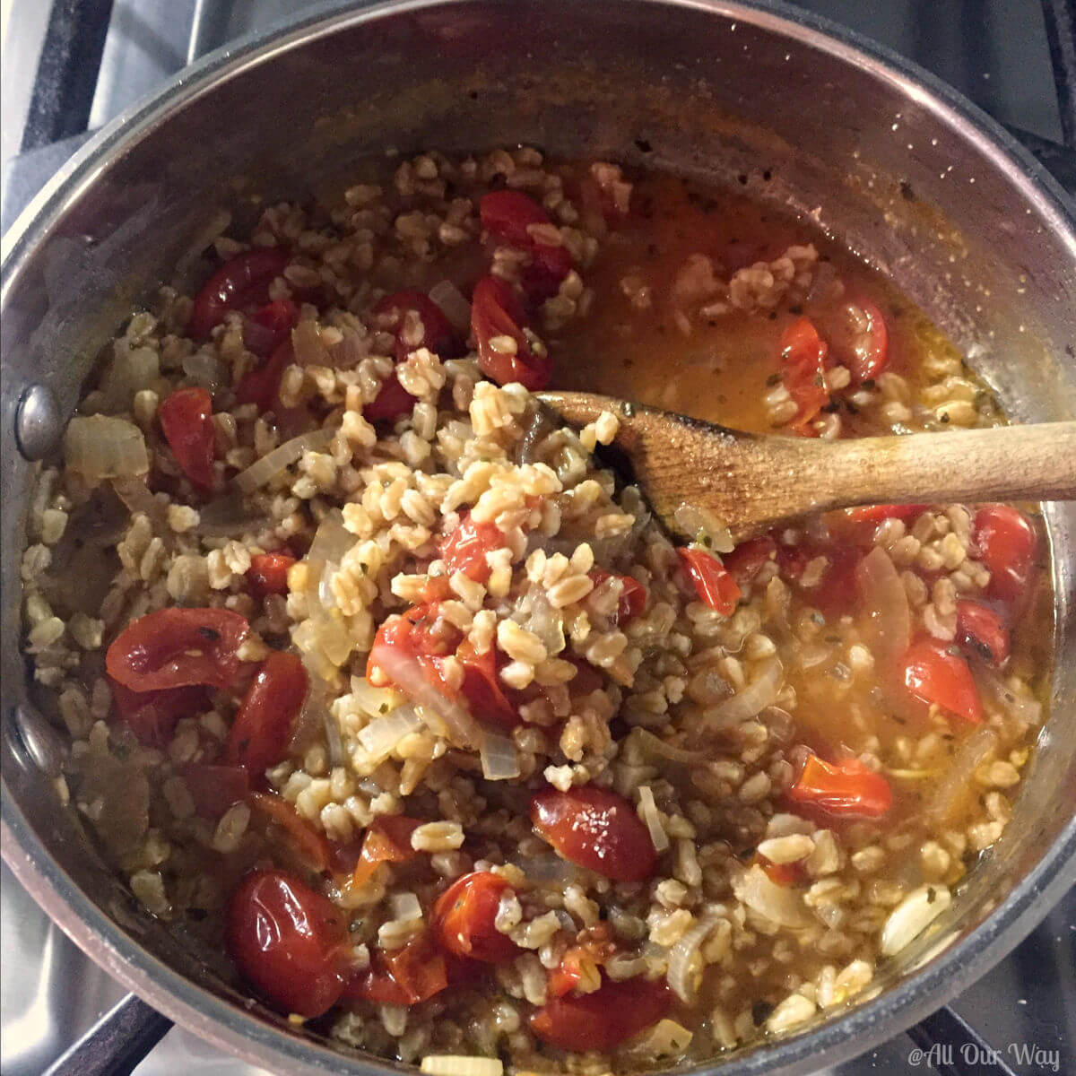 One-Pan Italian Farro with Tomatoes cooking in pan.