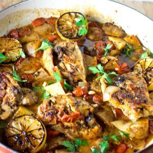 One Pan Italian Garlic Lemon Chicken Baiked with Potatoes and Fennel in a deep red pan. @allourway.com