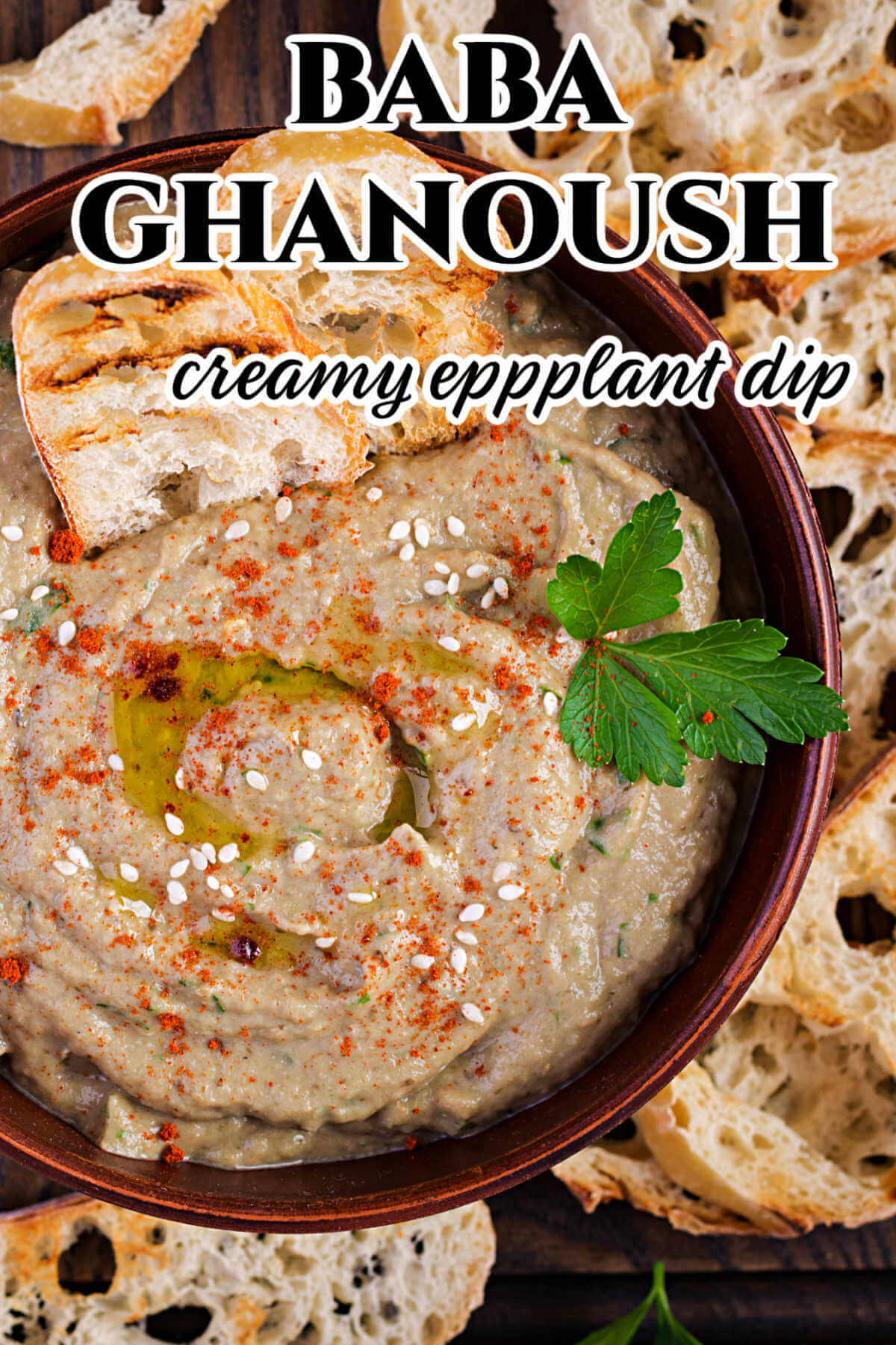 A bowl of the eggplant Mediterranean dip with bread slices. 