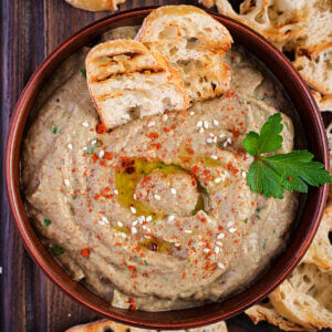 A bowl filled with baba ghanoush a Mediterranean dip.