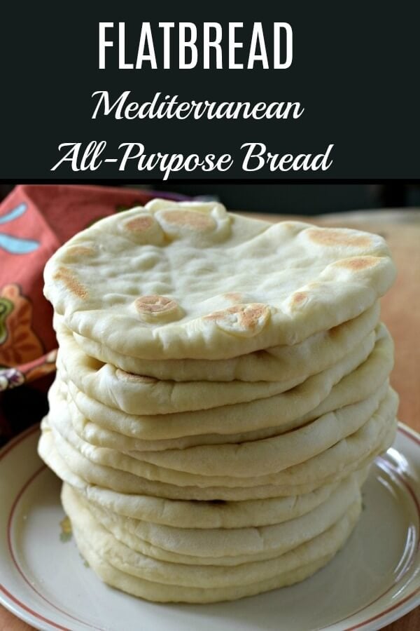 A tall stack of flatbread on a white plate with a rust-colored ring around it and a rust colored napkin in the background. 