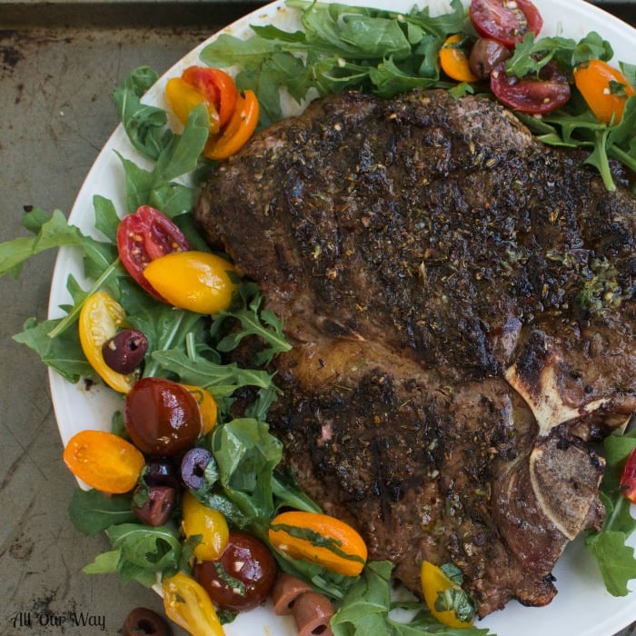 Grilled Porterhouse Steak Sicilian Style with Marinated Cherry Tomatoes over Arugula. Tuscan steak with a spicy marinade. 