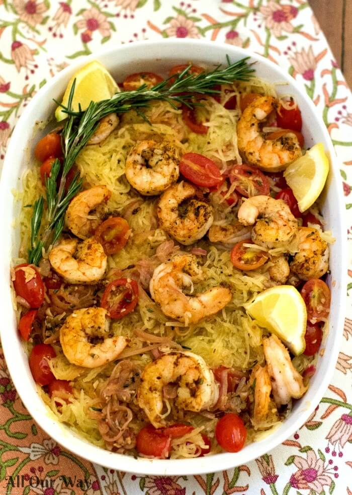 Sautéed shrimp with rosemary and tomato combined with spaghetti squash. A tasty easy one-pan meal.