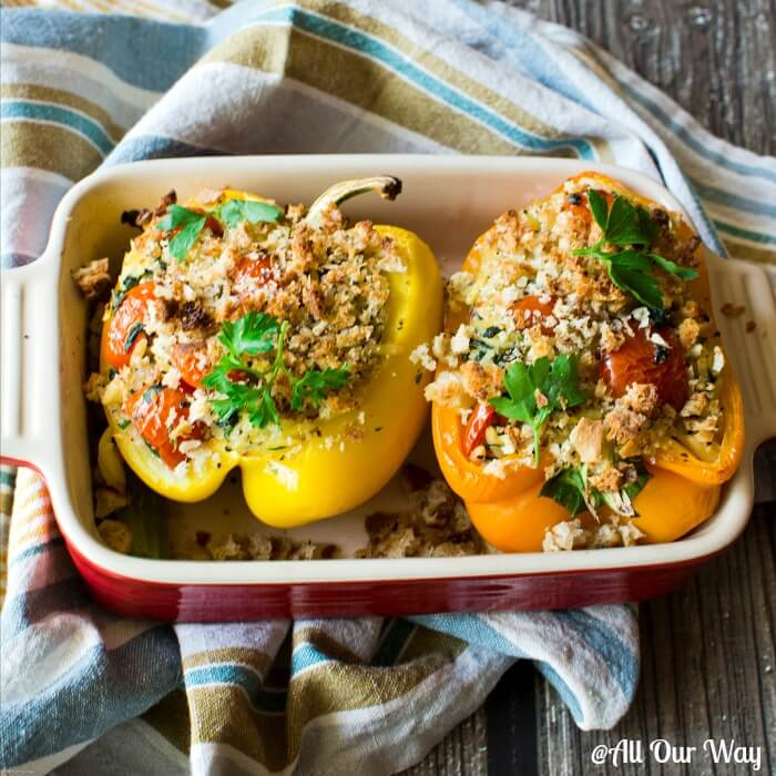 Orzo stuffed peppers Italian style with spinach and grape tomatoes and crunchy breadcrumb topping