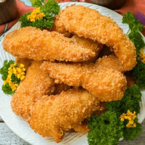 Crispy Fried Chicken cooks to a golden brown while the inside meat is moist and tender with a spicy tang.