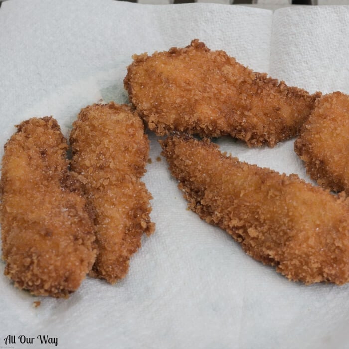 Crispy Fried Chicken cooks to a golden brown while the inside meat is moist and tender with a spicy tang. 