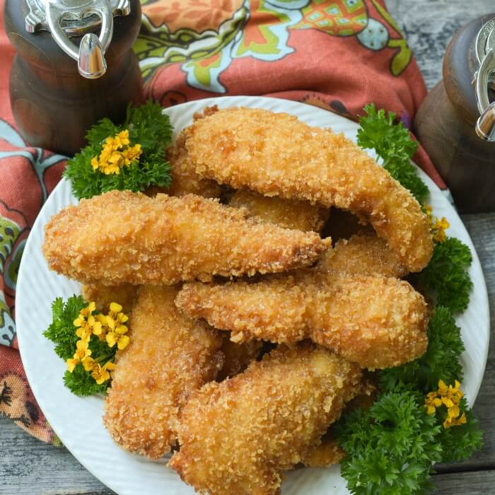 Crispy Fried Chicken cooks golden brown with a spicy tang. 