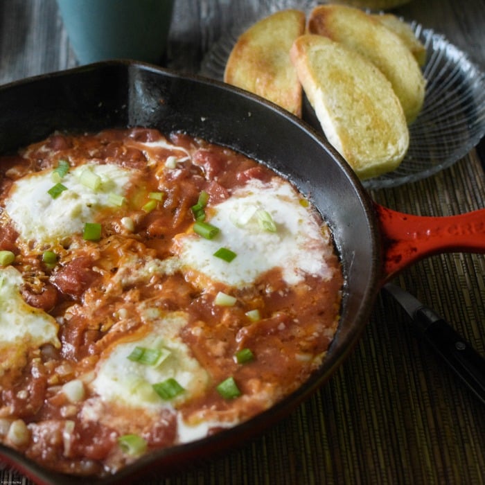 Spicy Eggs in Purgatory poaches eggs in a spicy tomato sauce. Quick and easy.