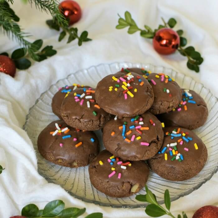Italian Chocolate Toto Cookies are Italian Holiday spice cookies studded with walnuts and mini-chocolate chips and flavored with spices and orange flavoring.
