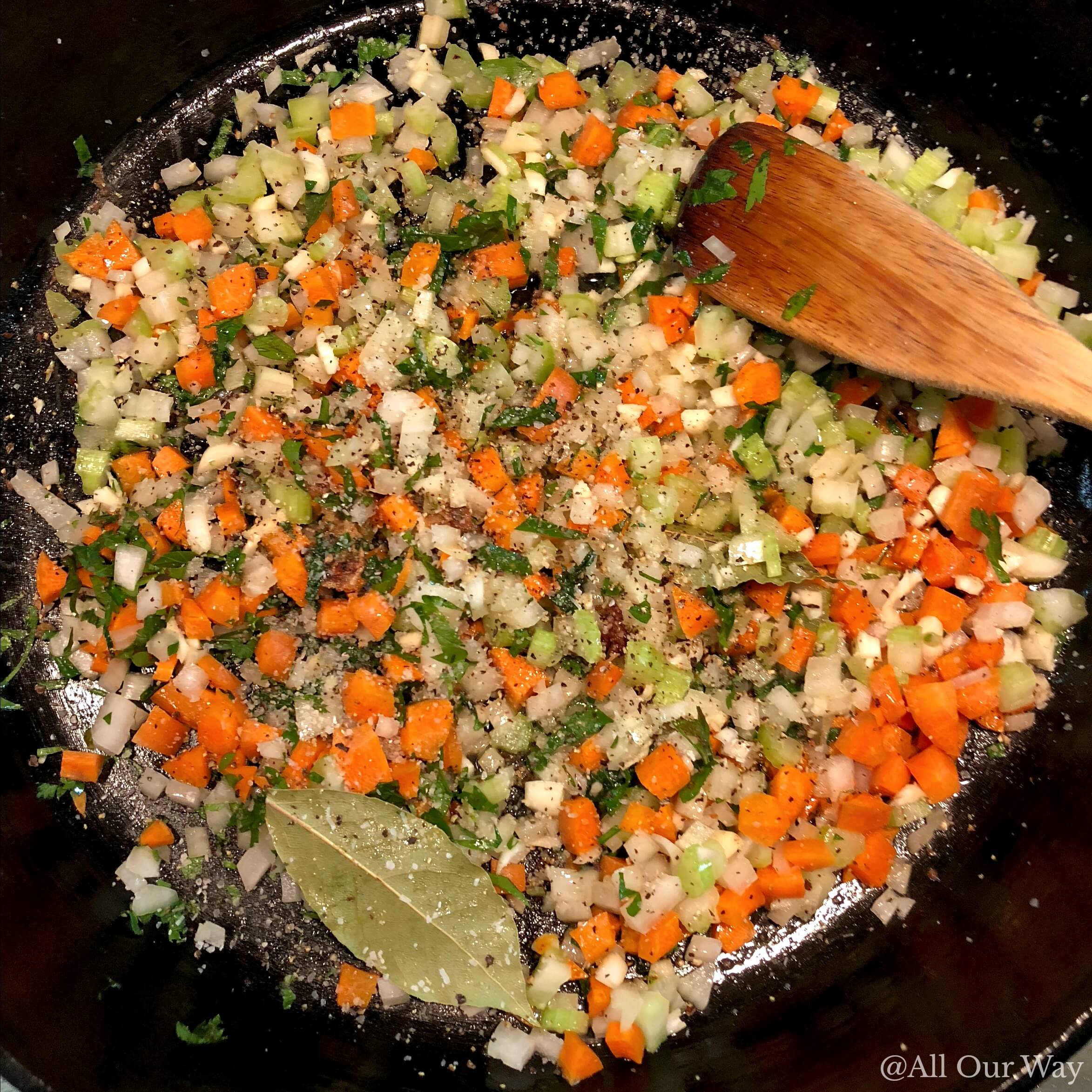 Vegetables sautéing in cast iron pan.