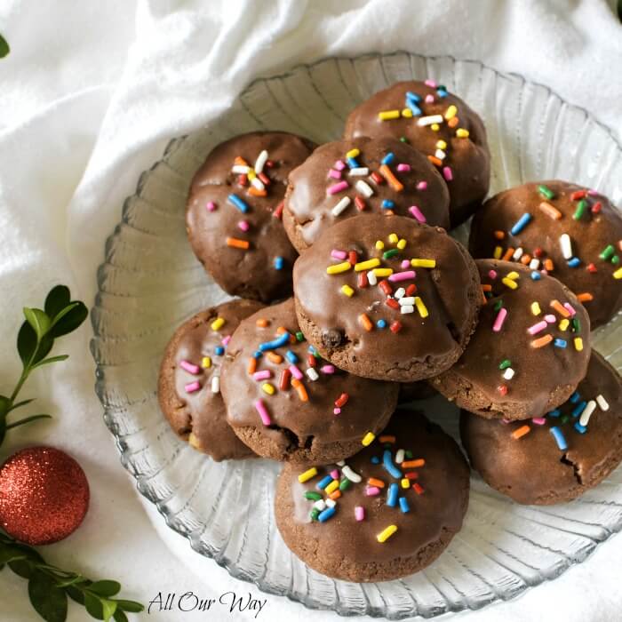 Italian Chocolate Toto Cookies are Christmas spice cookie that's studded with walnuts, chocolate chips, spices, and flavored with orange. Glazed with chocolate and topped with colorful sprinkles. #Italian_chocolate_cookie, #Italian_Christmas_cookie, #Totos, #spice_cookie, #meatball_cookie, #allourway