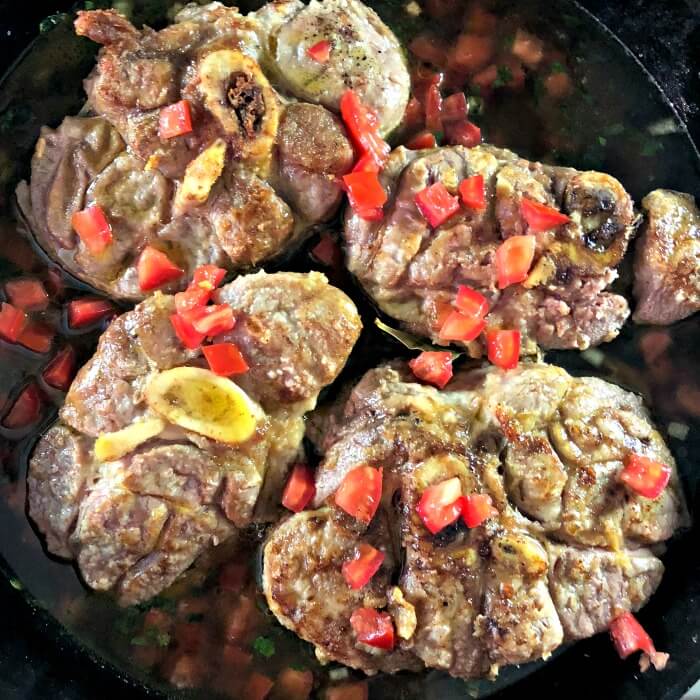 Veal Shanks in cast iron pan with vegetables