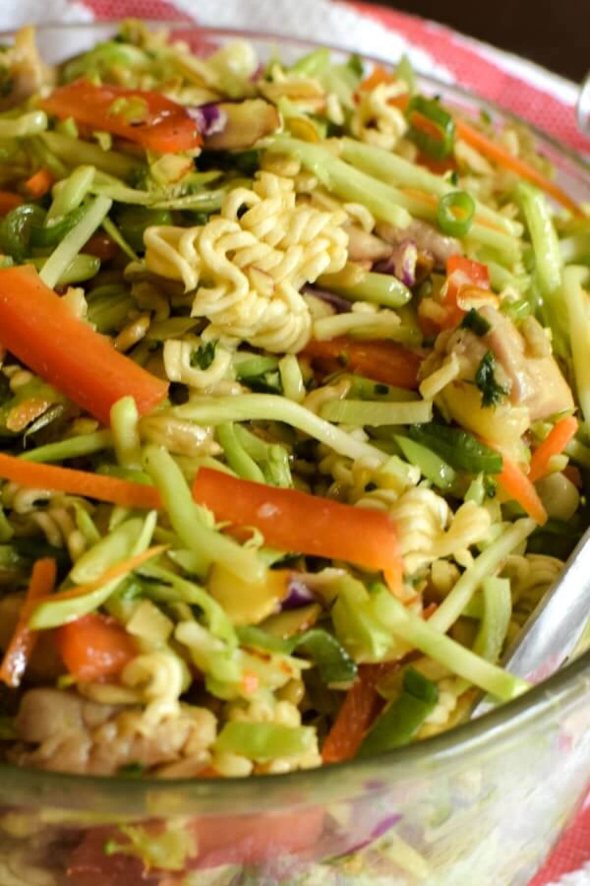 Asian Ramen Noodle broccoli Slaw Salad in glass bowl. 