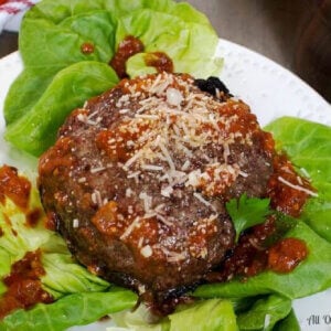 Portabella mushroom pizza hamburger with tangy tomato sauce is a satisfying meal without the additional bread.