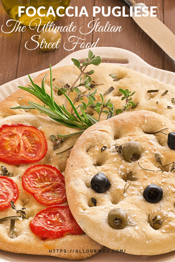 3 focaccia bread with different toppings, rosemary, tomato, and black olive with sprigs of rosemary and oregano in-between the round flatbreads. 