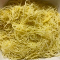 Al dente roasted spaghetti squash with the strands separate and golden.