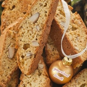 Gingerbread biscotti with almonds and a gold Christmas Ball