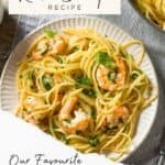 Lemon seafood pasta makes a fresh, easy weeknight dish. Served with a garnish of fresh basil.