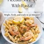 Piccata pasta with shrimp on a white plate served with extra lemon and parmesan cheese.