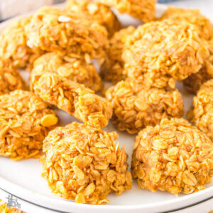 A plateful of stacked pumpkin oatmeal cookies stacked.