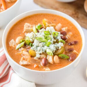 Buffalo Chicken Wings Soup garnished with bleu cheese and green onion.