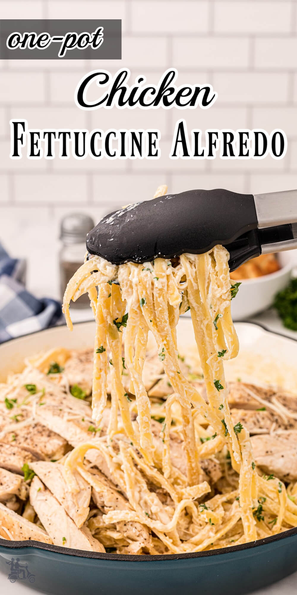 Pinterest image of Chicken Fettuccine Alfredo with tongs holding up pasta strands.
