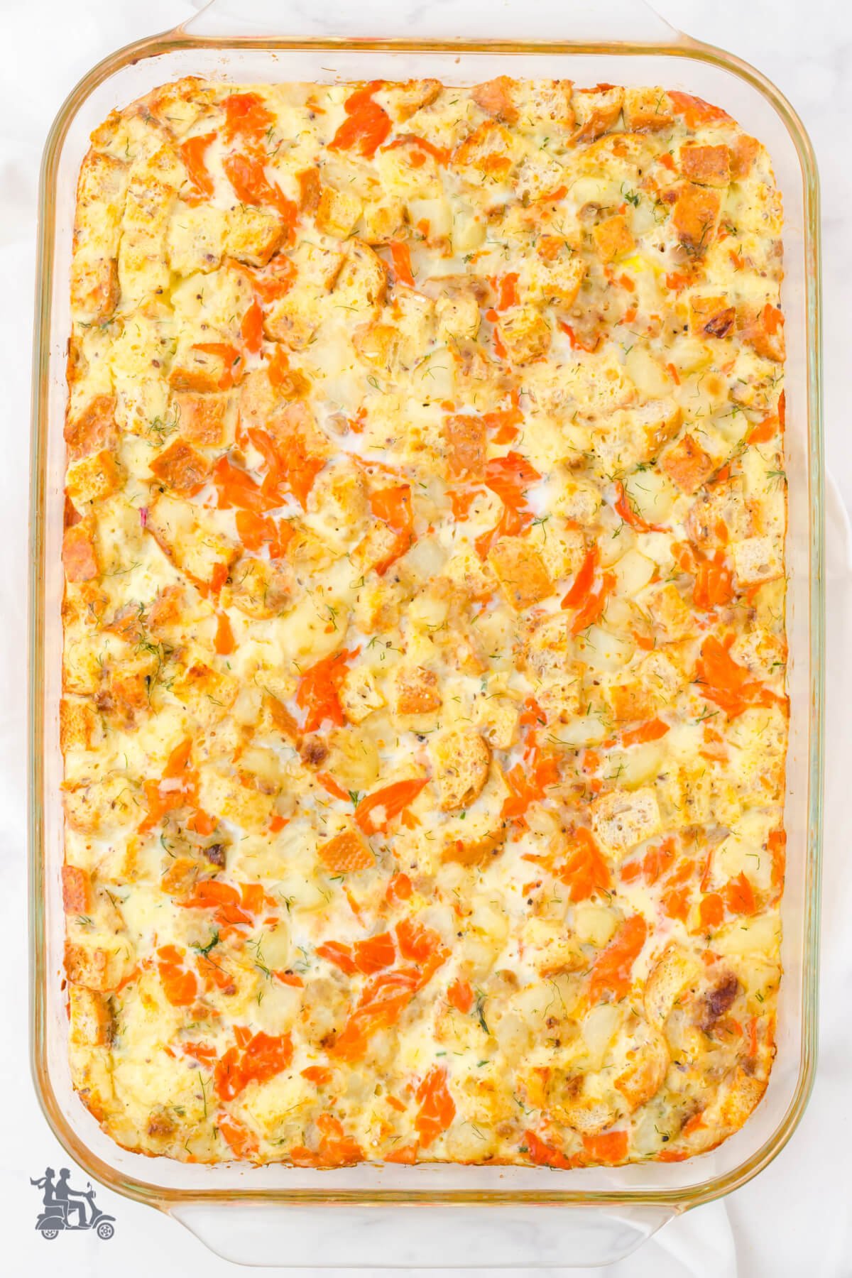 Breakfast casserole including smoked salmon, eggs, cream and seasonings. 