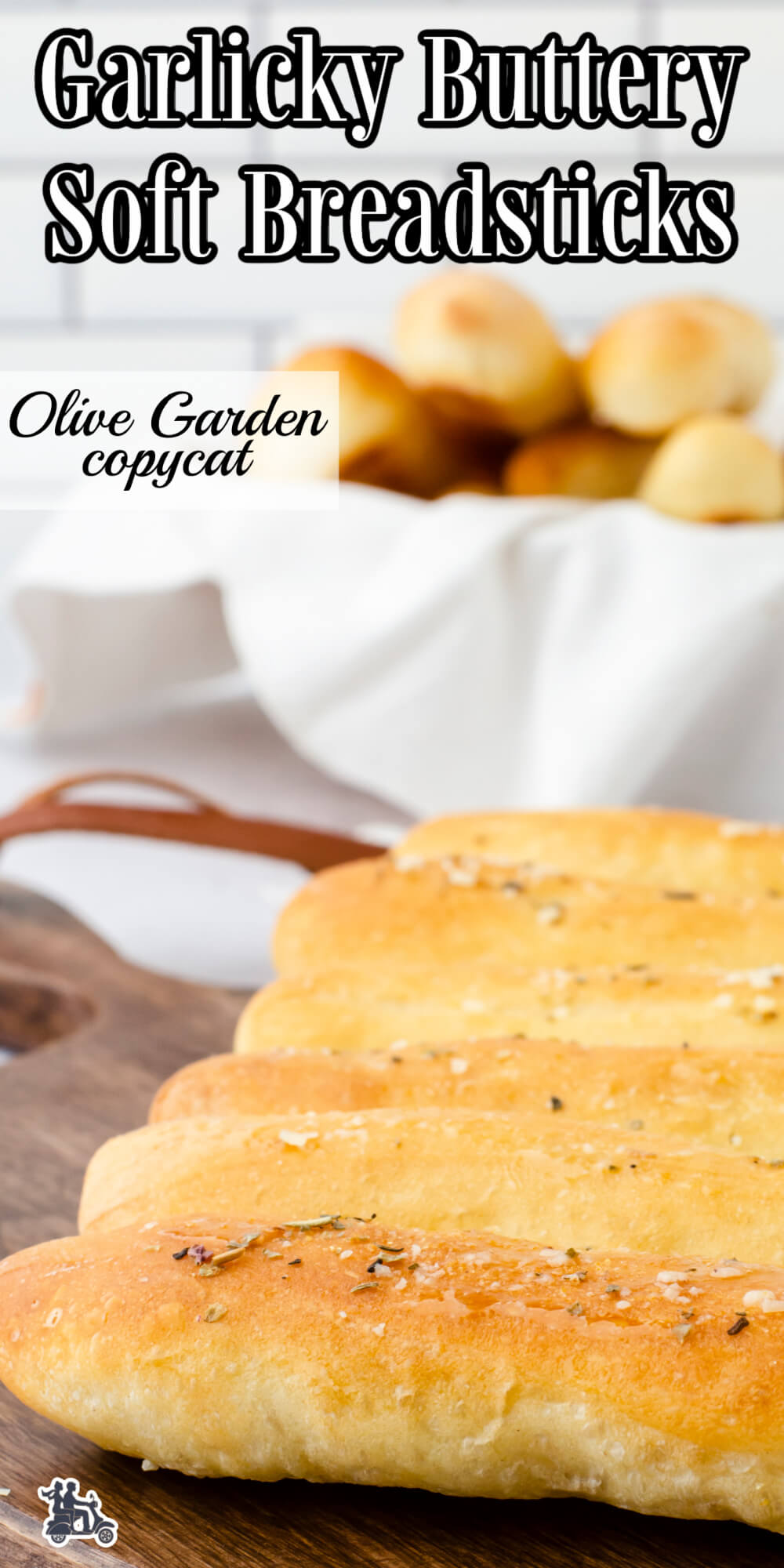 Soft Breadsticks on cutting board and some in breadbasket.