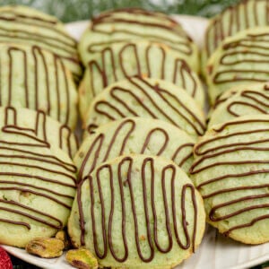 Chocolate Pistachio Cookies on a white plate.