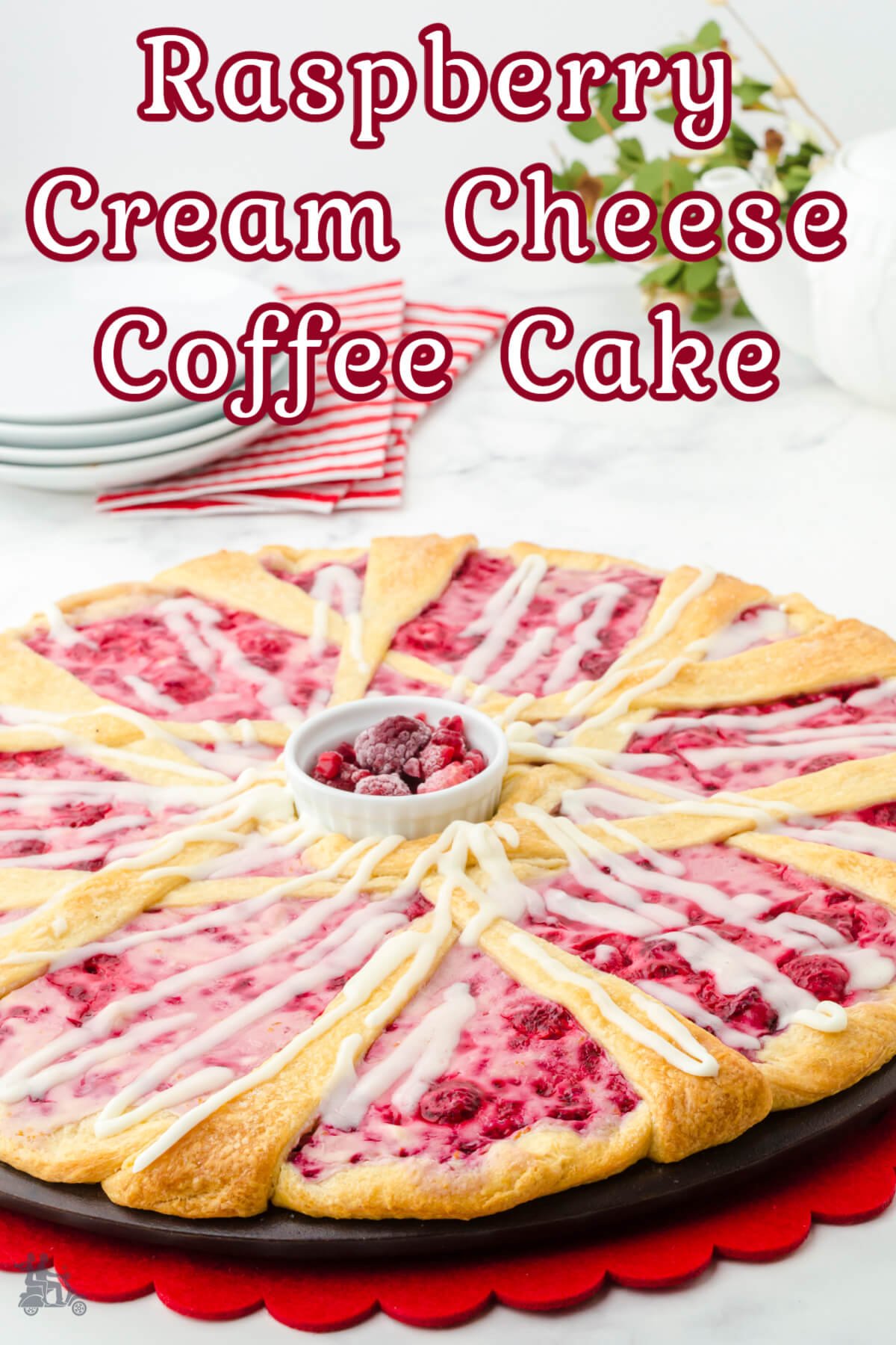 A raspberry cream cheese coffee cake made on a large round pizza pan. 